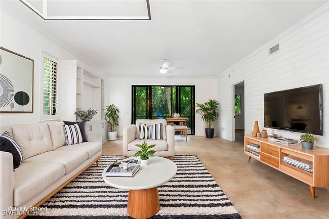 Virtually Staged: Living room with ornamental molding, a healthy amount of sunlight, and ceiling fan | Image 4