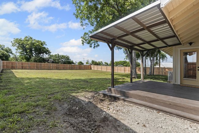 View of yard featuring a deck | Image 35