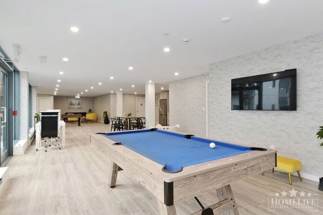 Game room featuring wallpapered walls, wood finished floors, pool table, and recessed lighting | Image 23