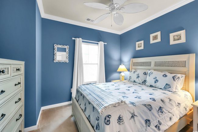 Carpeted bedroom featuring crown molding and ceiling fan | Image 10