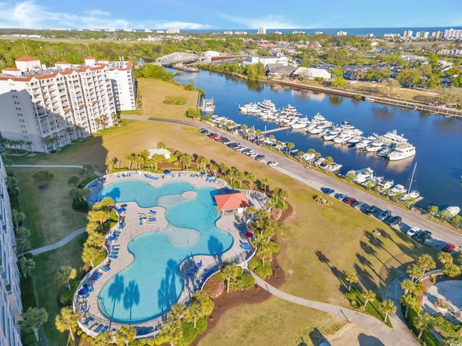 Aerial view of a nearby body of water and numerous boat docks | Image 32