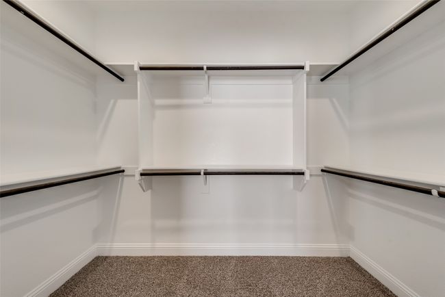 Spacious closet with carpet floors | Image 19