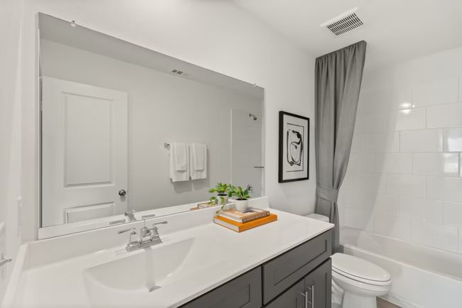 Photo of Pulte model home with same floor plan, not of actual home listed. | Image 9