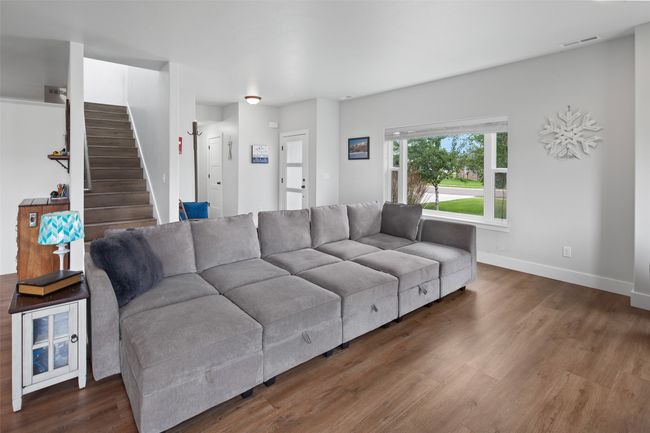 Living room to stairs to upper level. | Image 24