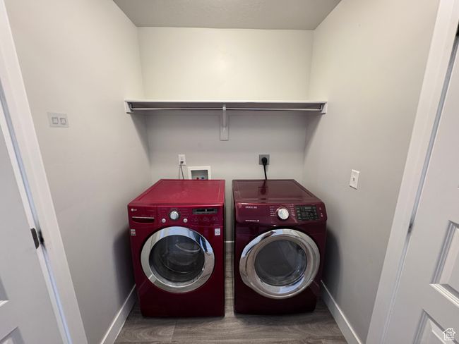 Laundry area with separate washer and dryer, laundry area, and baseboards | Image 20