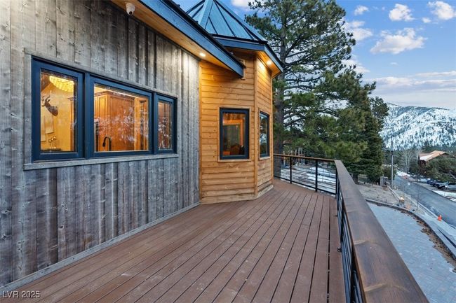 Wooden deck with a mountain view | Image 78