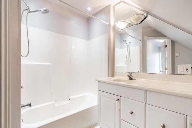 Full bath with lofted ceiling, shower combination, and vanity | Image 31