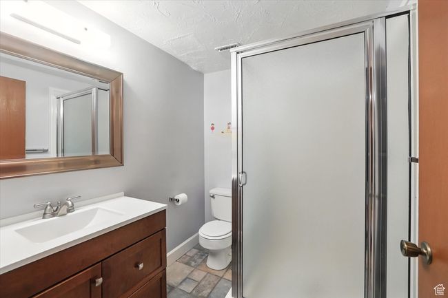 Bathroom featuring vanity, and a stall shower | Image 24