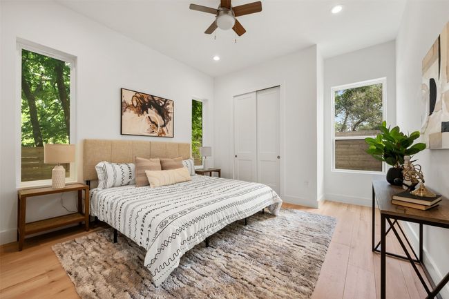 Bedroom with light wood finished floors, recessed lighting, a closet, baseboards, and a ceiling fan | Image 12