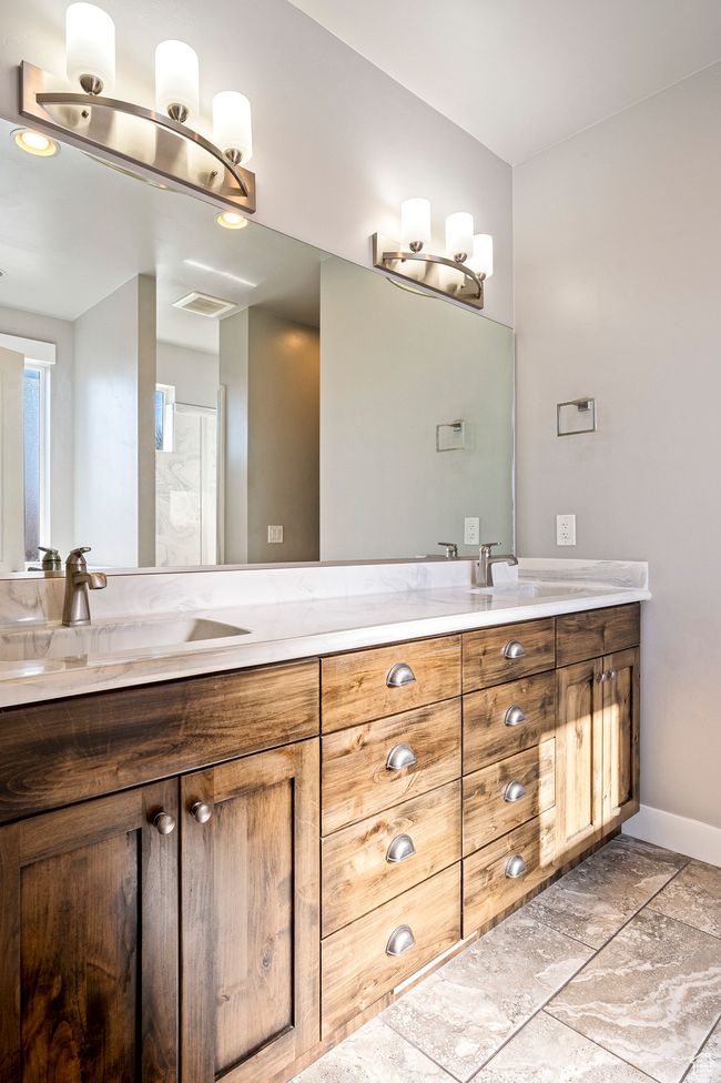 Full bath featuring a sink, visible vents, baseboards, and double vanity | Image 20