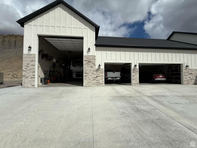 Garage featuring concrete driveway | Image 69