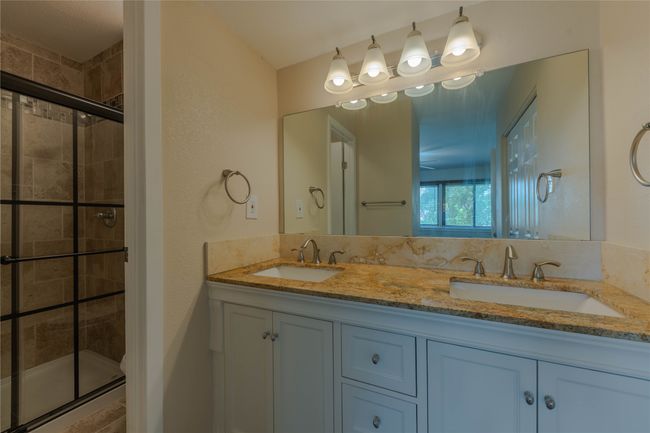 Full bath featuring a stall shower and double vanity | Image 20