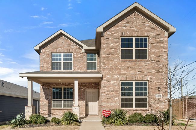 Traditional-style house featuring brick siding and a porch | Image 22