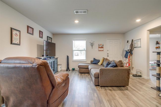 Living room with vinyl flooring | Image 5