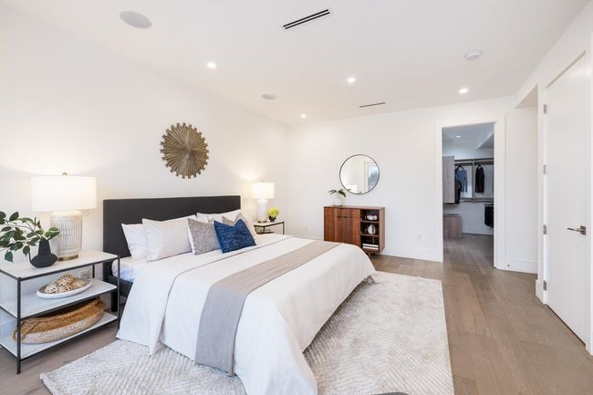 Bedroom with visible vents, a walk in closet, baseboards, light wood-type flooring, and recessed lighting | Image 22