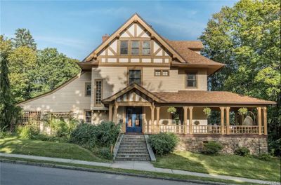 View of the front of the home showing the wraparound porch | Image 1