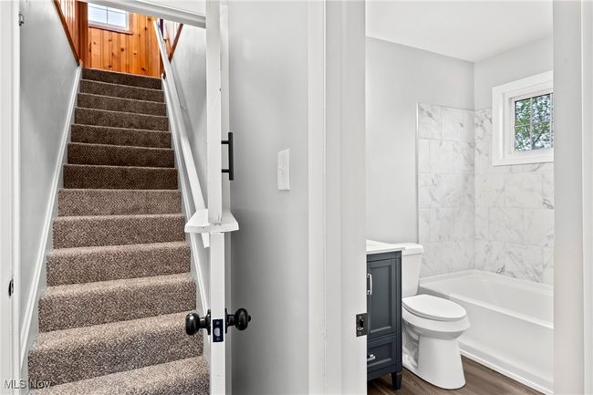 Stairway featuring wood finished floors | Image 25