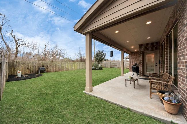 Check out the fully fenced backyard with no back neighbors! Those trees behind the fence can't wait for the spring! | Image 32