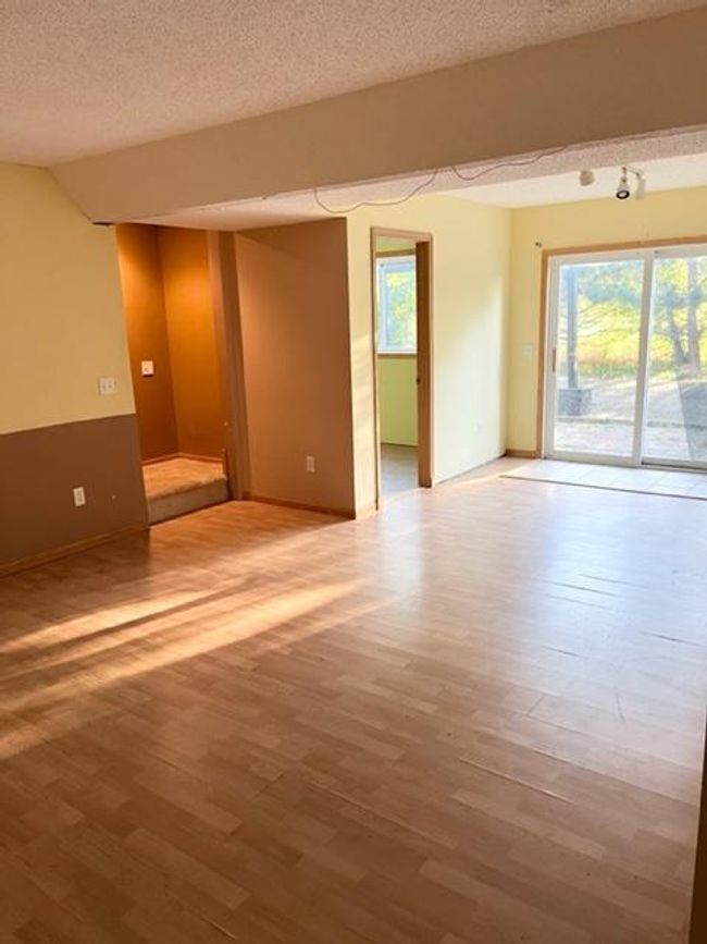 Wonderful space and high ceilings in the lower level. Plenty of space for a family room as well as a game room! Great for whatever your needs are! | Image 12