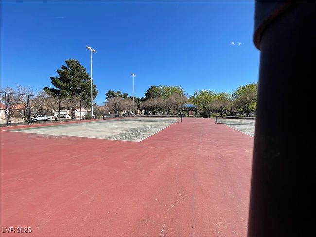 View of tennis court with fence | Image 53