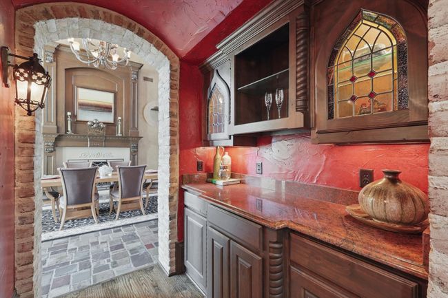 The butler's pantry is across from the wine cellar and has plenty of storage space. | Image 8