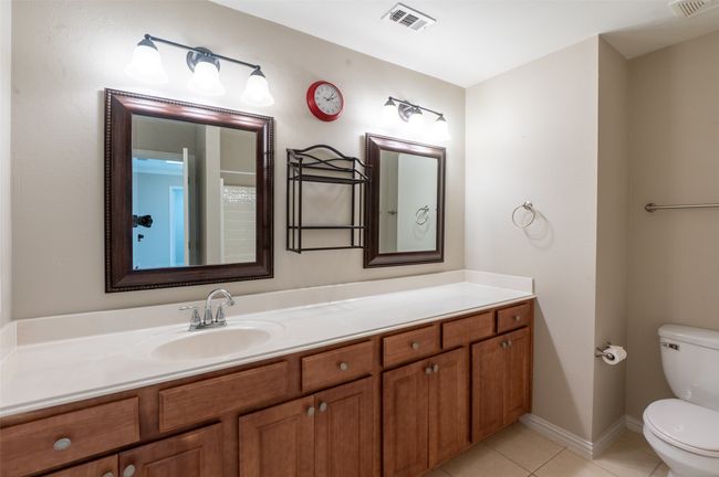 Secondary bathroom with large vanity. | Image 15
