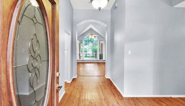 Foyer with vinyl plank floors and baseboards | Image 5
