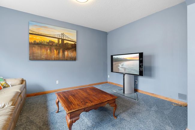 Lower-level first bedroom suite separate sitting area. Wired LAN available. | Image 51