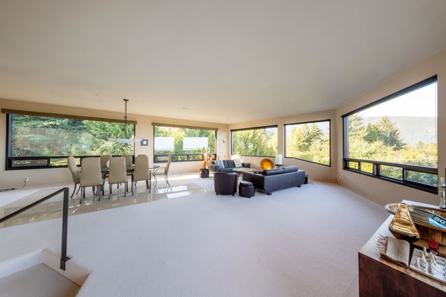 Living room featuring carpet flooring and baseboards | Image 36
