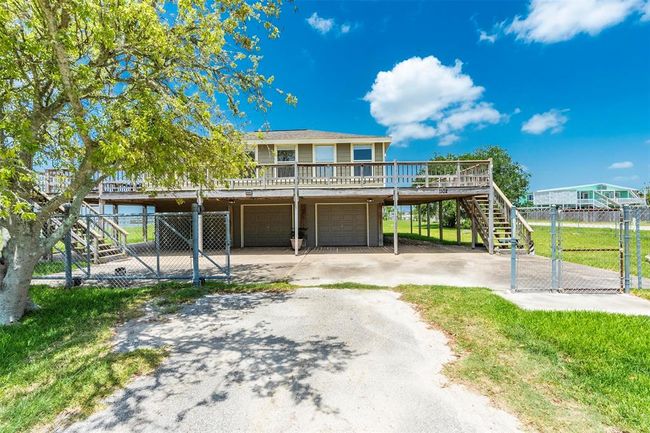 Two sets of stairs leading to the wrap around deck | Image 7