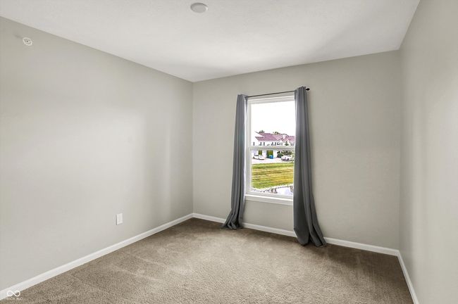 carpeted second bedroom. Rough in for ceiling fan/overhead lighting | Image 27