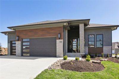 View of front of house featuring a garage | Image 1