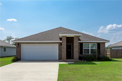 View of front facade featuring a garage and a front yard | Image 2