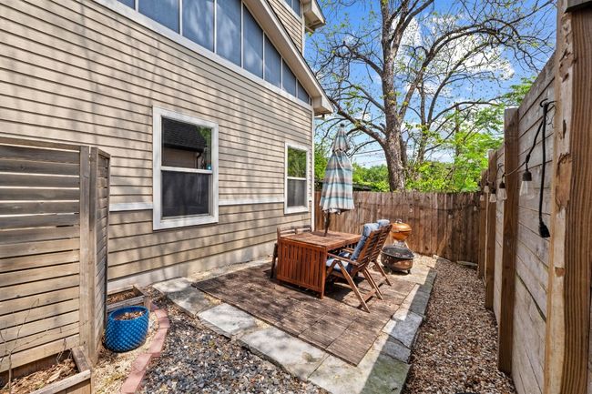 View of patio with a fenced backyard | Image 24