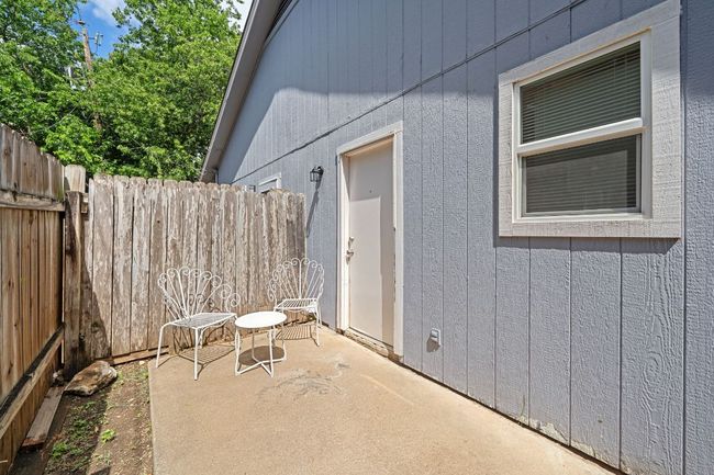 Private backyard fully fenced with two points of entrance - one from inside of the home and one from the front yard. | Image 30