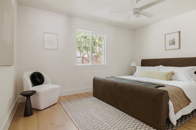 Bedroom featuring wood finished floors and ceiling fan | Image 20