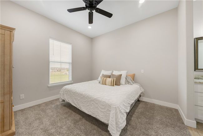 Bedroom featuring baseboards, recessed lighting, light carpet, and a ceiling fan | Image 22