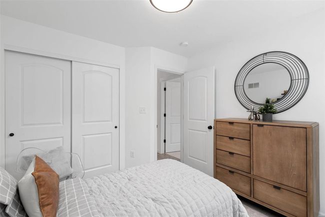 Carpeted bedroom featuring a closet | Image 12