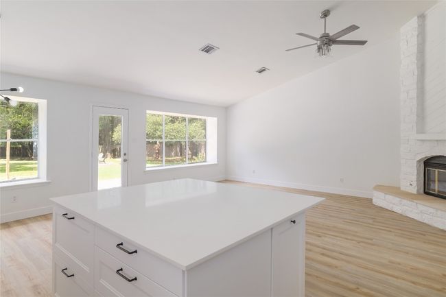 Kitchen island features storage. | Image 12