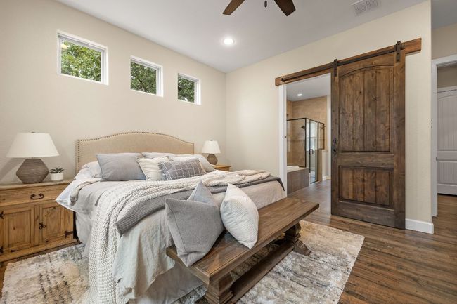 Custom barn door to the en-suite bath. | Image 17