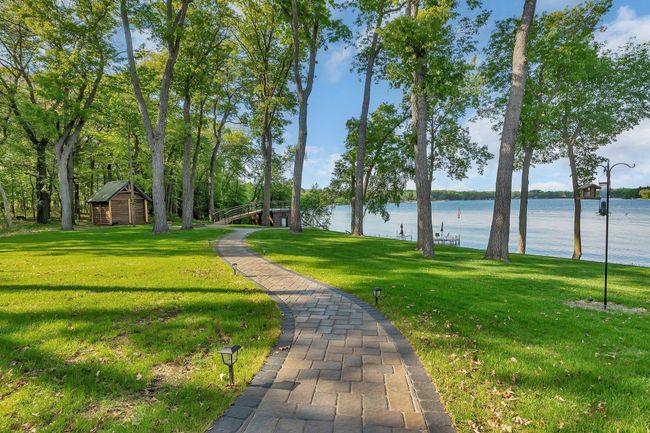 Enjoy panoramic lake views along the beautifully landscaped walkway leading down to the water’s edge. | Image 11