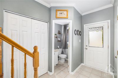 The front foyer is big enough to get inside, get your boots off and not trip all over each other, The powder room right off the entry is a bonus as well. | Image 2