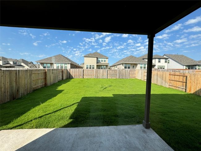View of yard featuring a residential view and a patio area | Image 26