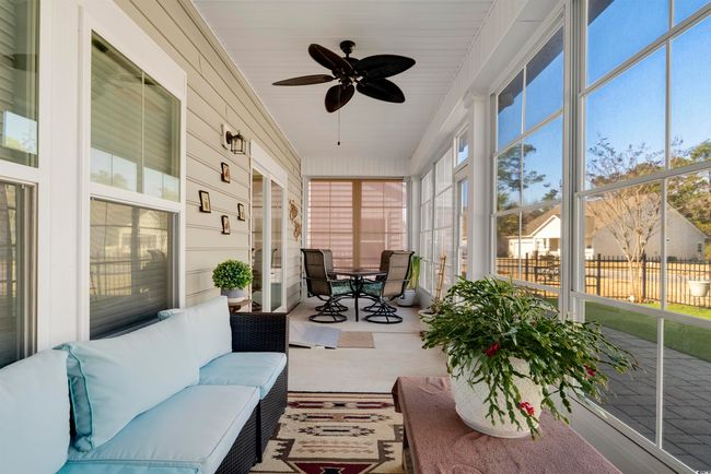 Sunroom / solarium featuring ceiling fan and plenty of natural light | Image 34