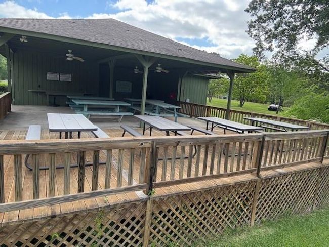 Ideal for gatherings, this charming community picnic area offers spacious seating and a covered pavilion for year-round enjoyment. | Image 29