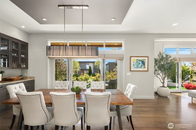 We just love that this home has so many easy transitions to the beautiful outdoor patios! Summer is almost here! | Image 9