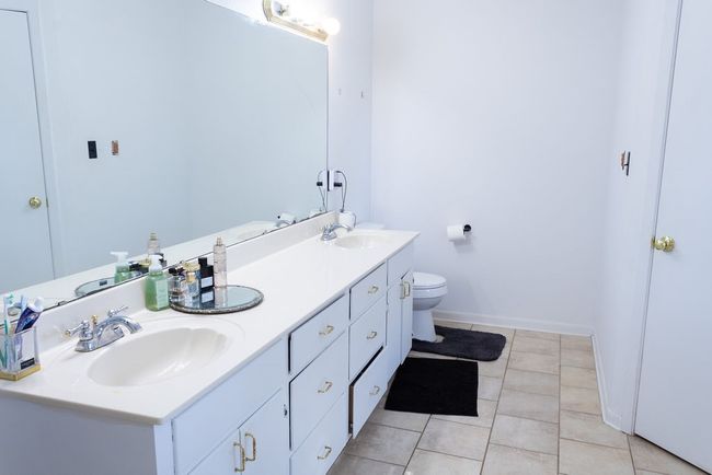 Full bath featuring double vanity and tile patterned flooring | Image 18