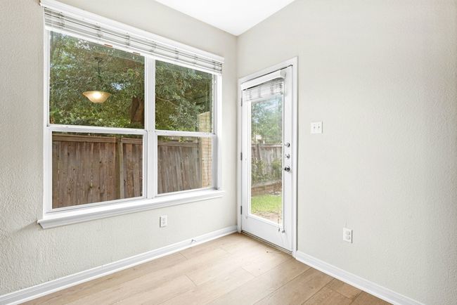 Empty room featuring baseboards and wood finished floors | Image 15