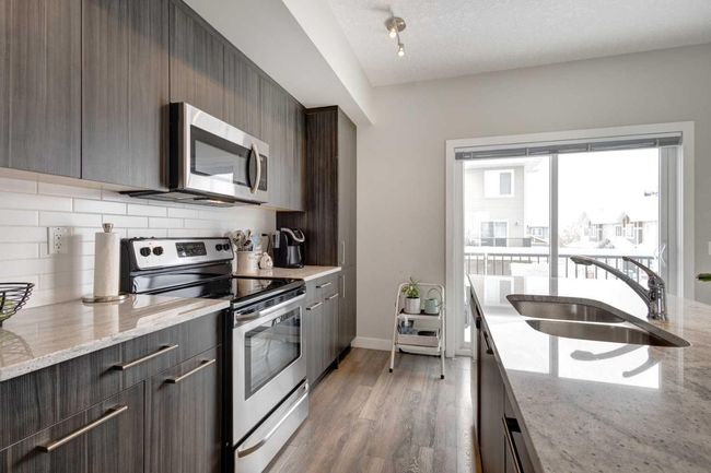 107 - 2802 Kings Heights Gate Se, Home with 3 bedrooms, 2 bathrooms and 2 parking in Airdrie AB | Image 12