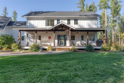 Modern inspired farmhouse featuring a front lawn and covered porch | Image 2